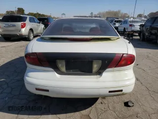 1995 Pontiac Sunfire SE z VIN 1G2JB1244S7508975, wystawiony jako Copart lot #76954164 z przebiegiem 76 187 mil mil oraz Tytuł czysty. Historia ofert i sprzedaży dostępna na DreamBid. Obrazek 6.