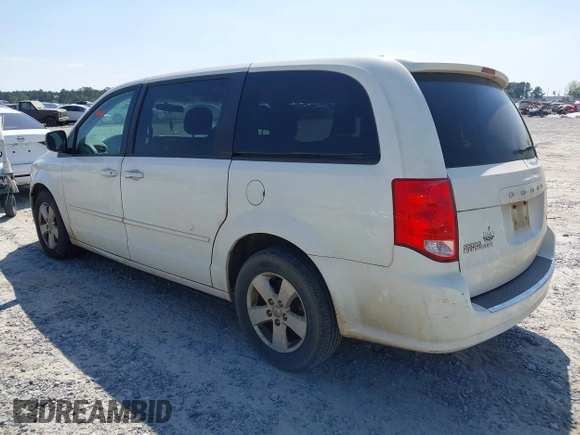 2013 Dodge Grand Caravan SE with VIN 2C4RDGBG9DR516044, listed as a IAAI auction lot 41998893 with 214,645 mi miles and . Bid and sale history available at DreamBid. Image 3.