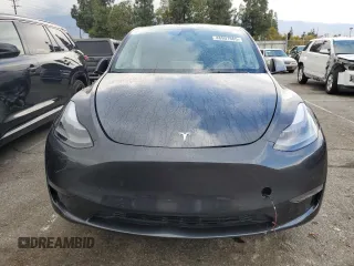 2024 Tesla Model Y with VIN 7SAYGDED1RF052031, listed as a Copart auction lot 48507865 with 5,365 mi miles and Salvage title. Bid and sale history available at DreamBid. Image 5.