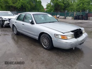 2001 Mercury Grand Marquis GS z VIN 2MEFM74W91X618246, wystawiony jako IAAI lot #42226130 z przebiegiem 125 487 mil mil oraz . Historia ofert i sprzedaży dostępna na DreamBid. Obrazek 1.