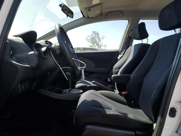 2012 Honda Fit Sport with VIN JHMGE8H50CC009958, listed as a Copart auction lot 55423075 with 117,618 mi miles and Salvage Title. Bid and sale history available at DreamBid. Image 7.