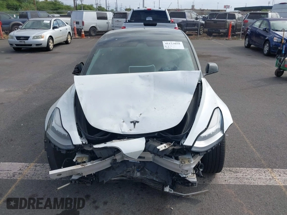 2019 Tesla Model 3 Mid Range with VIN 5YJ3E1EA6KF396946, listed as a IAAI auction lot 41123058 with 69,013 mi miles and . Bid and sale history available at carsss.com. Image 13.