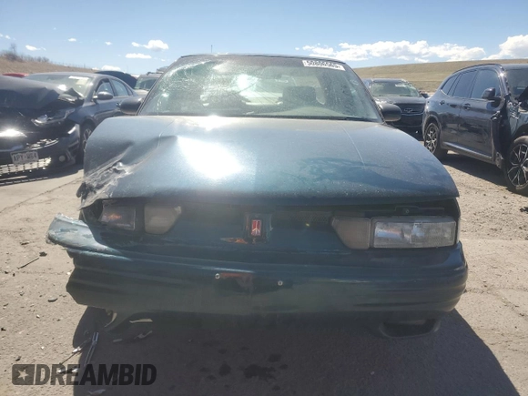 1997 Oldsmobile Cutlass Supreme S z VIN 1G3WH52M7VF349340, wystawiony jako Copart lot #50806565 z przebiegiem 1 254 585 mil mil oraz Szkody całkowita. Historia ofert i sprzedaży dostępna na DreamBid. Obrazek 5.