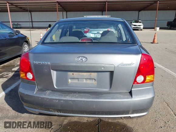 2004 Hyundai Accent GL with VIN KMHCG45C04U531177, listed as a IAAI auction lot 41526033 with 126,102 mi miles. Bid and sale history available at carsss.com. Image 16.