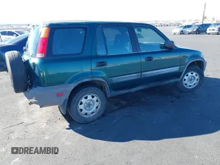 1999 Honda CR-V LX with VIN JHLRD1847XC031475, listed as a IAAI auction lot 41606369 with 254,445 mi miles. Bid and sale history available at carsss.com. Image 4.
