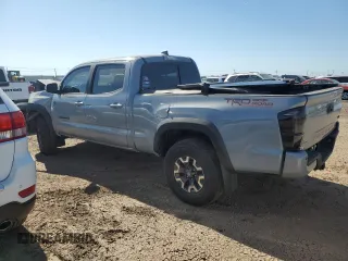 2021 Toyota Tacoma SR5 with VIN 3TMDZ5BN9MM099515, listed as a Copart auction lot 56687385 with 66,721 mi miles and Salvage title. Bid and sale history available at DreamBid. Image 2.