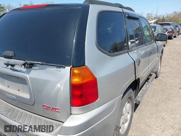 2004 GMC Envoy SLE with VIN 1GKDT13S042113411, listed as a IAAI auction lot 42117824 with 116,827 mi miles. Bid and sale history available at carsss.com. Image 4.