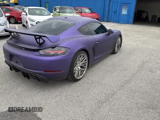 2018 Porsche 718 Cayman S z VIN WP0AB2A8XJK279655, wystawiony jako Copart lot #60089495 z przebiegiem 59 291 mil mil oraz Czysty tytuł • Clean title. Historia ofert i sprzedaży dostępna na DreamBid. Obrazek 4.