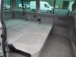 2001 Volkswagen EuroVan MV с VIN WV2MB47031H098986, выставлен на аукционе Copart как лот 77587294 с пробегом 161 046 миль миль и Чистый • Clean title. История ставок и продаж доступна на DreamBid. Изображение 11.