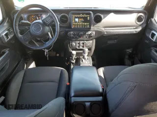 2023 Jeep Wrangler Sport with VIN 1C4HJXDN9PW512460, listed as a Copart auction lot 77107894 with 23,142 mi miles and Salvage Title. Bid and sale history available at DreamBid. Image 8.