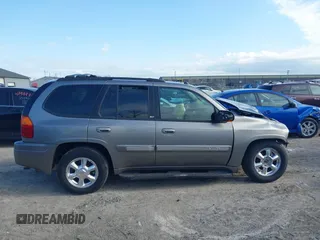 2005 GMC Envoy SLE with VIN 1GKDT13S852362380, listed as a IAAI auction lot 42031727 with 76,711 mi miles. Bid and sale history available at carsss.com. Image 14.
