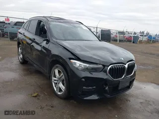 2021 BMW X1 xDrive28i with VIN WBXJG9C01M3M71033, listed as a IAAI auction lot 41723970 with 71,000 mi miles. Bid and sale history available at carsss.com. Image 6.