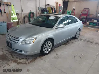 2005 Toyota Avalon XL with VIN 4T1BK36BX5U045813, listed as a IAAI auction lot 42061631 with 150,436 mi miles. Bid and sale history available at carsss.com. Image 2.