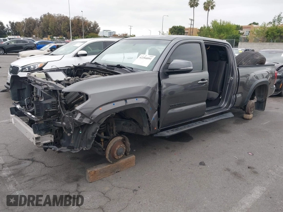 2017 Toyota Tacoma SR5 with VIN 3TMDZ5BN1HM021526, listed as a IAAI auction lot 42204091 with 82,802 mi miles and . Bid and sale history available at DreamBid. Image 2.