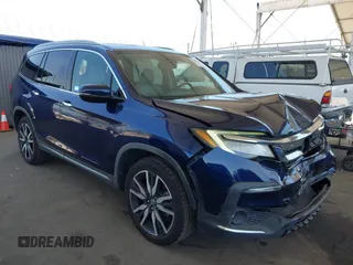 2019 Honda Pilot Touring 8-Passenger z VIN 5FNYF5H97KB013530, wystawiony jako IAAI lot #42403449 z przebiegiem 90 557 mil mil oraz . Historia ofert i sprzedaży dostępna na DreamBid. Obrazek 1.