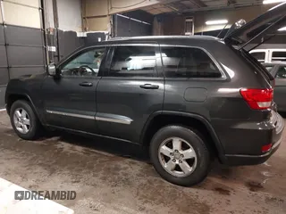 2011 Jeep Grand Cherokee 70th Anniversary with VIN 1J4RR4GG3BC566690, listed as a IAAI auction lot 41810545 with 173,886 mi miles. Bid and sale history available at carsss.com. Image 3.