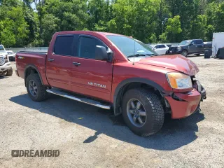 2015 Nissan Titan Pro-4X with VIN 1N6BA0EC5FN506358, listed as a Copart auction lot 56671205 with 153,712 mi miles and Salvage title. Bid and sale history available at DreamBid. Image 4.