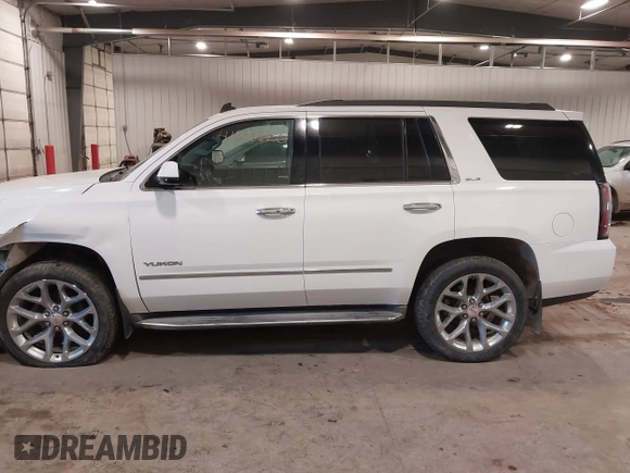 2015 GMC Yukon SLE with VIN 1GKS2AKC6FR103447, listed as a IAAI auction lot 41596220 with 104,209 mi miles. Bid and sale history available at carsss.com. Image 14.