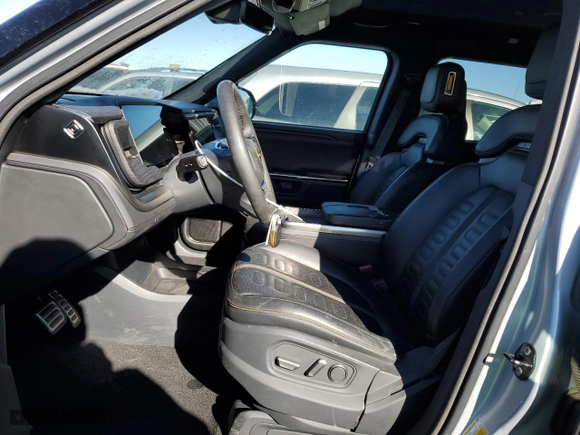 2023 Rivian R1T Adventure with VIN 7FCTGAAA5PN017311, listed as a Copart auction lot 42523755 with 35,039 mi miles and Salvage Title. Bid and sale history available at carsss.com. Image 7.