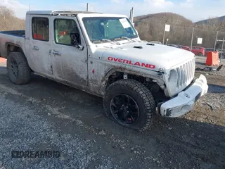 2023 Jeep Gladiator Overland z VIN 1C6HJTFG4PL514441, wystawiony jako IAAI lot #41416018 z przebiegiem 56 478 mil mil oraz . Historia ofert i sprzedaży dostępna na DreamBid. Obrazek 1.
