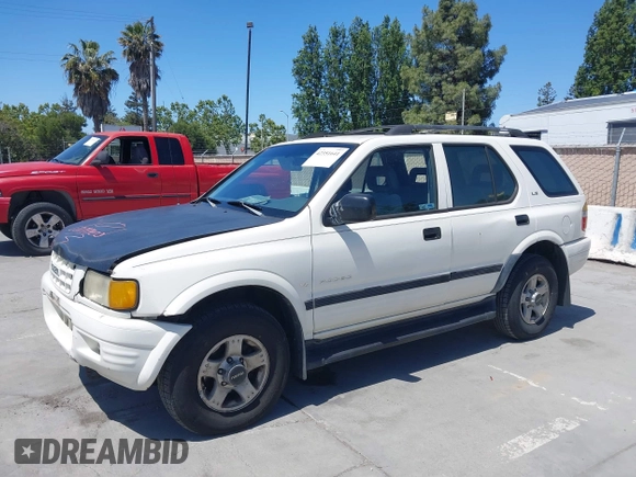 1999 Isuzu Rodeo S z VIN 4S2CM58WXX4347611, wystawiony jako IAAI lot #42351641 z przebiegiem 256 007 mil mil oraz . Historia ofert i sprzedaży dostępna na DreamBid. Obrazek 6.