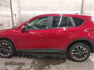 2016 Mazda CX-5 Grand Touring with VIN JM3KE4DY7G0731057, listed as a IAAI auction lot 41118072 with 134,107 mi miles and . Bid and sale history available at carsss.com. Image 15.