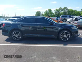 2013 Ford Taurus SHO z VIN 1FAHP2KT1DG135962, wystawiony jako IAAI lot #42449604 z przebiegiem 138 921 mil mil oraz . Historia ofert i sprzedaży dostępna na DreamBid. Obrazek 13.