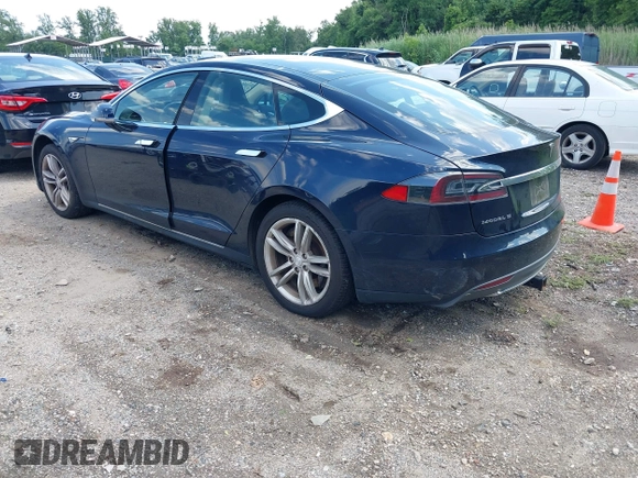 2013 Tesla Model S with VIN 5YJSA1CN0DFP21851, listed as a IAAI auction lot 42557791 with 106,328 mi miles and . Bid and sale history available at DreamBid. Image 3.