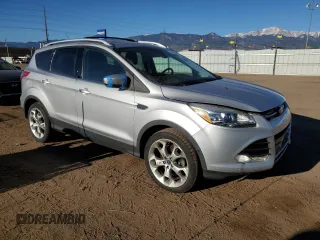 2014 Ford Escape Titanium with VIN 1FMCU9J9XEUB10861, listed as a Copart auction lot 50766115 with 134,469 mi miles and Salvage Title. Bid and sale history available at DreamBid. Image 4.