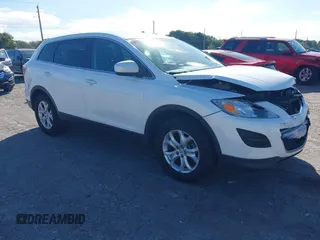 2012 Mazda CX-9 Sport z VIN JM3TB2BA6C0357512, wystawiony jako IAAI lot #41309715 z przebiegiem 148 944 mil mil oraz . Historia ofert i sprzedaży dostępna na DreamBid. Obrazek 1.