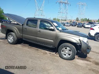 2015 Toyota Tacoma with VIN 3TMMU4FN5FM082376, listed as a IAAI auction lot 42144113 with 98,244 mi miles and . Bid and sale history available at DreamBid. Image 1.