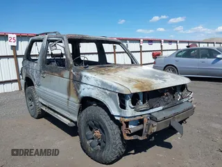 1991 Mitsubishi Montero z VIN 2BG70124X43000753, wystawiony jako IAAI lot #42055421 z przebiegiem Nie podano mil oraz . Historia ofert i sprzedaży dostępna na DreamBid. Obrazek 1.