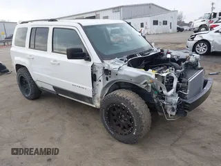 2016 Jeep Patriot Sport SE with VIN 1C4NJPBA5GD700309, listed as a IAAI auction lot 41673265 with 123,977 mi miles and . Bid and sale history available at carsss.com. Image 1.