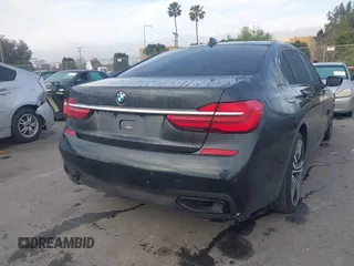 2016 BMW 7 Series 740i with VIN WBA7E2C51GG547537, listed as a IAAI auction lot 41794434 with 149,655 mi miles. Bid and sale history available at carsss.com. Image 4.