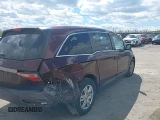2013 Honda Odyssey LX with VIN 5FNRL5H28DB058401, listed as a IAAI auction lot 42050892 with 221,016 mi miles and . Bid and sale history available at carsss.com. Image 6.