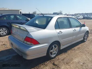 2003 Mitsubishi Lancer OZ-Rally with VIN JA3AJ86E23U069464, listed as a IAAI auction lot 41775000 with 148,735 mi miles. Bid and sale history available at carsss.com. Image 4.