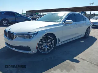 2018 BMW 7 Series 750i with VIN WBA7F0C57JGM23667, listed as a IAAI auction lot 41581035 with 113,140 mi miles and . Bid and sale history available at DreamBid. Image 2.