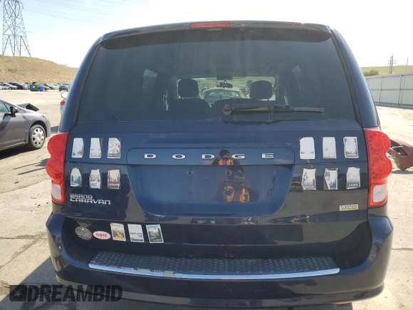 2014 Dodge Grand Caravan SE with VIN 2C4RDGBG4ER400512, listed as a Copart auction lot 52416965 with 141,475 mi miles and Clean Title. Bid and sale history available at DreamBid. Image 6.
