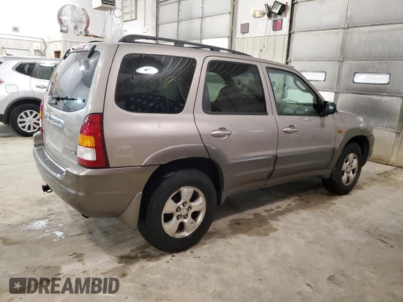2001 Mazda Tribute LX with VIN 4F2CU08101KM05943, listed as a Copart auction lot 84077694 with 137,937 mi miles and Salvage Title. Bid and sale history available at DreamBid. Image 3.