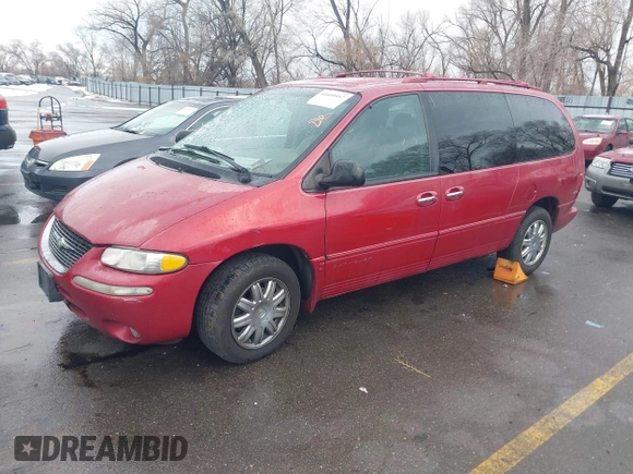 1999 Chrysler Town & Country with VIN 1C4GT64L7XB723937, listed as a IAAI auction lot 41609957 with 242,800 mi miles and . Bid and sale history available at DreamBid. Image 2.