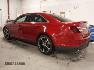 2014 Ford Taurus SHO with VIN 1FAHP2KT9EG130834, listed as a IAAI auction lot 41748199 with 98,857 mi miles and . Bid and sale history available at carsss.com. Image 3.