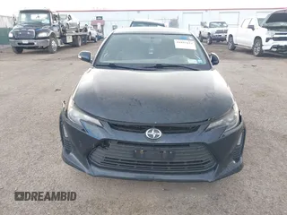 2015 Scion tC with VIN JTKJF5C7XFJ001662, listed as a IAAI auction lot 41843123 with 128,851 mi miles. Bid and sale history available at carsss.com. Image 12.