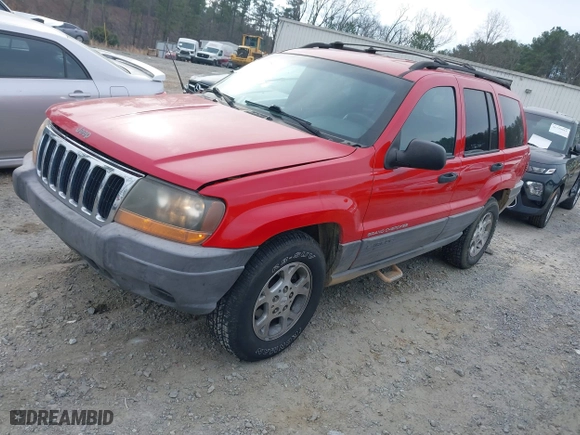 1999 Jeep Grand Cherokee Laredo with VIN 1J4GW58S0XC519908, listed as a IAAI auction lot 41789905 with 221,064 mi miles. Bid and sale history available at carsss.com. Image 18.