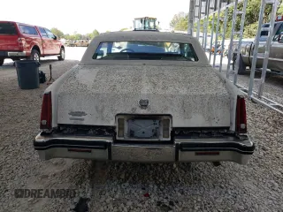 1983 Cadillac Eldorado z VIN 1G6AL5787DE628931, wystawiony jako Copart lot #73113774 z przebiegiem 28 559 mil mil oraz Tytuł czysty. Historia ofert i sprzedaży dostępna na DreamBid. Obrazek 6.
