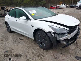 2023 Tesla Model 3 z VIN 5YJ3E1EA3PF658462, wystawiony jako IAAI lot #40729035 z przebiegiem 10 417 mil mil oraz . Historia ofert i sprzedaży dostępna na DreamBid. Obrazek 1.