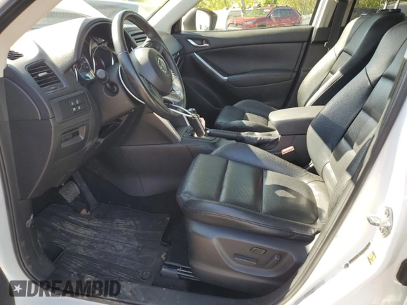 2014 Mazda CX-5 Grand Touring with VIN JM3KE4DY2E0354795, listed as a Copart auction lot 54205775 with 62,939 mi miles and Salvage Title. Bid and sale history available at DreamBid. Image 7.