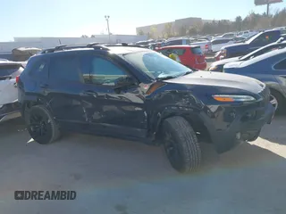2017 Jeep Cherokee Trailhawk L Plus with VIN 1C4PJMBBXHW634944, listed as a IAAI auction lot 41022673 with 116,542 mi miles. Bid and sale history available at carsss.com. Image 14.