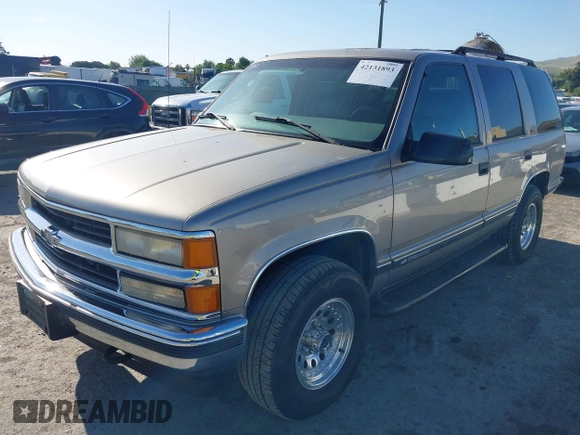 1999 Chevrolet Tahoe Z71 with VIN 1GNEK13R7XJ521373, listed as a IAAI auction lot 42131893 with 250,712 mi miles and . Bid and sale history available at DreamBid. Image 2.