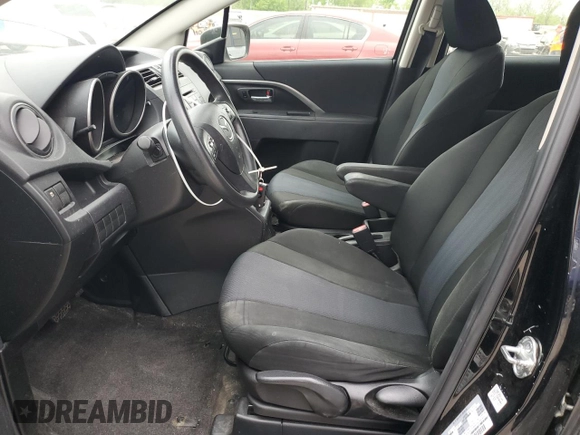 2015 Mazda 5 Sport with VIN JM1CW2BLXF0184094, listed as a Copart auction lot 56618405 with 98,757 mi miles and Salvage title. Bid and sale history available at DreamBid. Image 7.