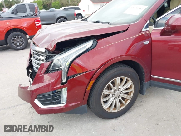 2017 Cadillac XT5 FWD with VIN 1GYKNARS2HZ107587, listed as a IAAI auction lot 41614842 with 124,611 mi miles and . Bid and sale history available at carsss.com. Image 6.